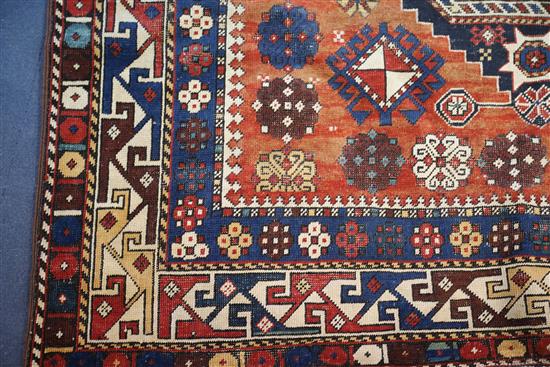 An antique Shirvan red ground rug, 6ft 9in by 4ft 5in.